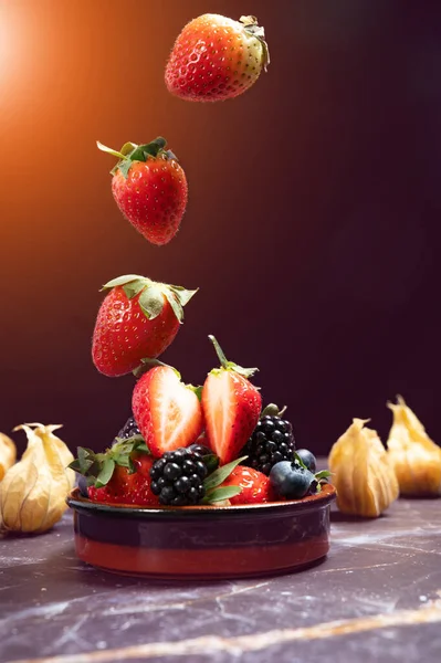 Falling Strawberry Porceline Pot Mix Berries Dark Marble Background Copy —  Fotos de Stock