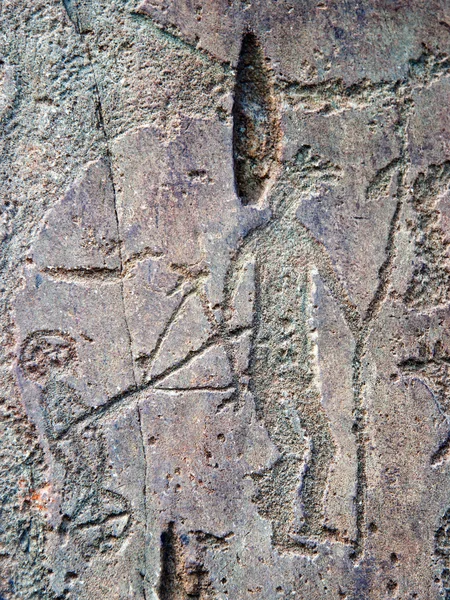 Bild av gamla nomader, präglad på stenen. Royaltyfria Stockbilder