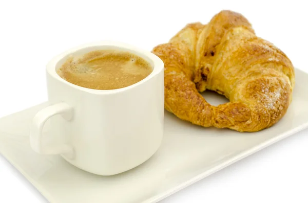 Croissant y una taza de café —  Fotos de Stock