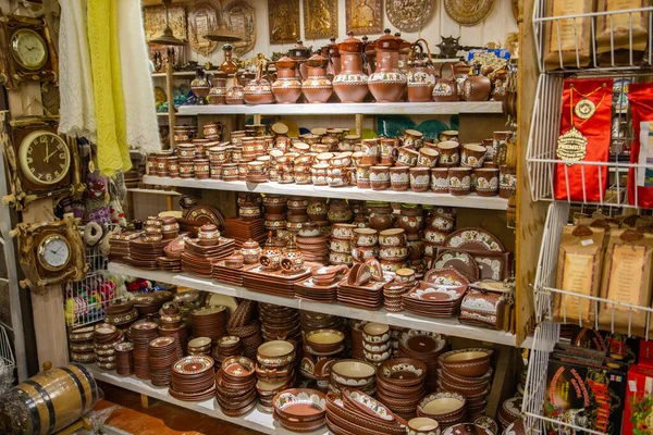 Ukrainian national dishes in the market, a counter with pottery in the market