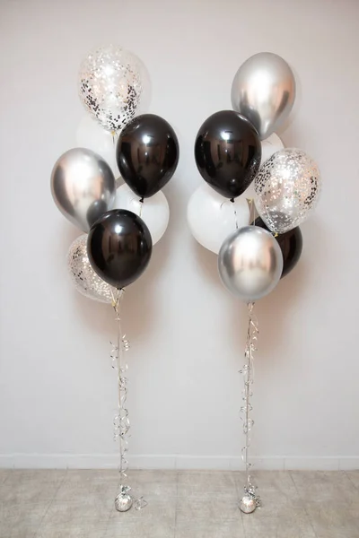 arrangement of black and silver balloons for birthday