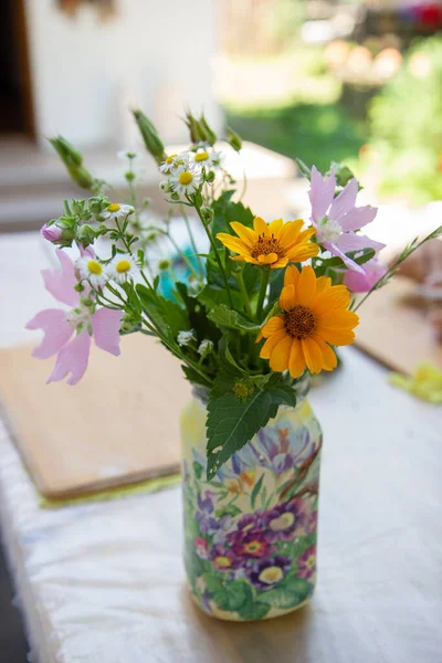 wild flowers in a handmade vase