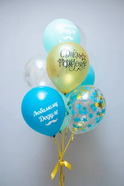 Set of mint and golden birthday balloons. The inscription 