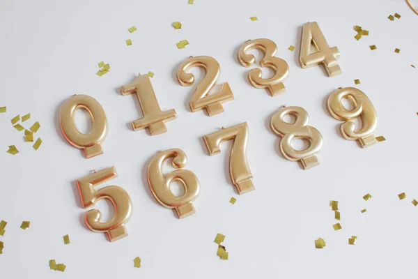 golden candle numbers in a cake from 0 to 9