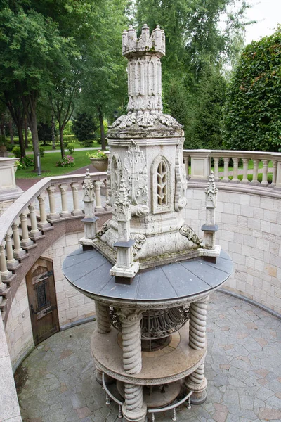 large stone fireplace outside, stone staircase