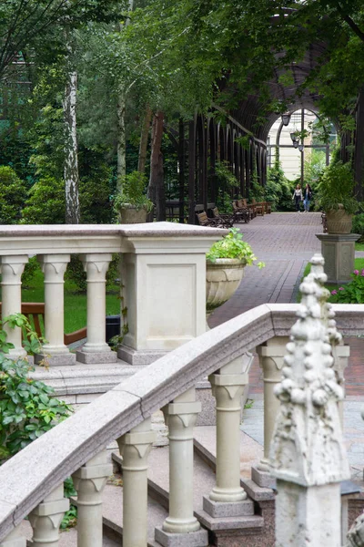 large stone fireplace outside, stone staircase