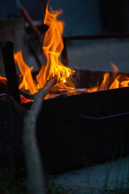 cooking camp on grill at summer time at sunset.