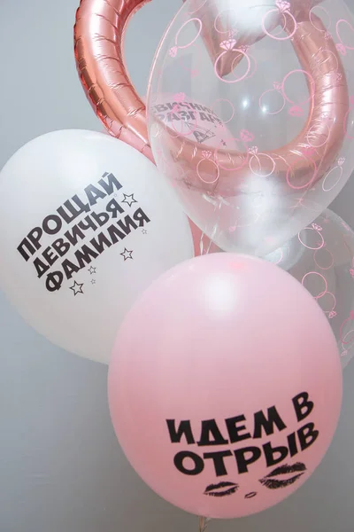 set of pink helium balloons for a bachelorette party, balloon wedding ring