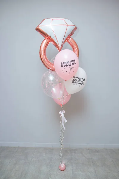 set of pink helium balloons for a bachelorette party, balloon wedding ring