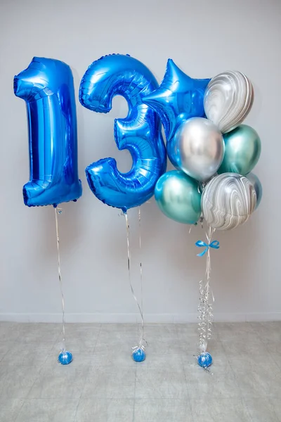 A set of blue balloons, foil balloons numbers 1 and 3, holiday decor with helium balloons