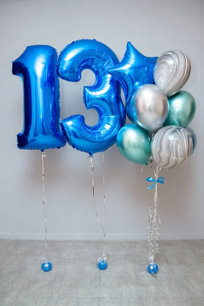 A set of blue balloons, foil balloons numbers 1 and 3, holiday decor with helium balloons