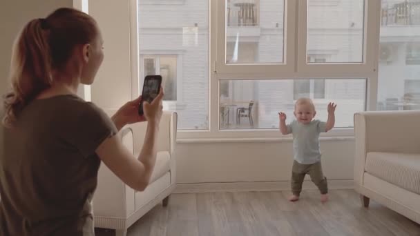 Young Mother Taking Video Her Adorable Baby First Steps Using — ストック動画