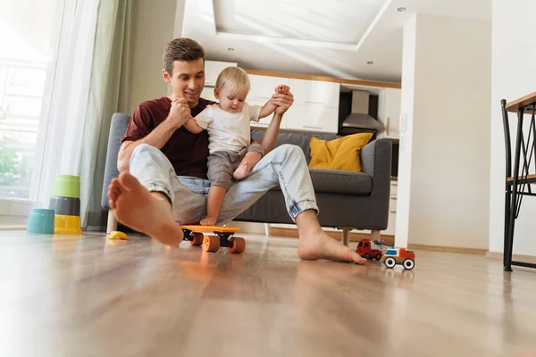 Young Father Playing His Little Baby Boy Living Room Holding — Stock fotografie