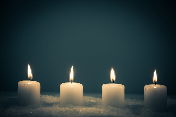 Four White Candles on Snow