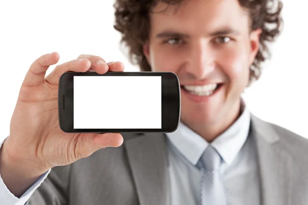 Uomo d'affari in possesso di uno smartphone — Foto Stock