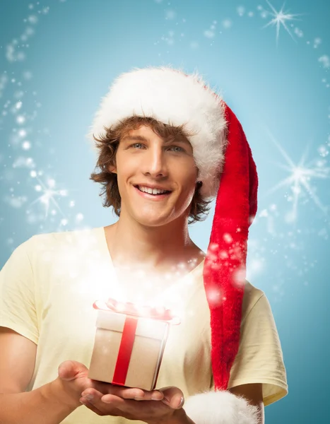 Joven Santa con un regalo — Foto de Stock