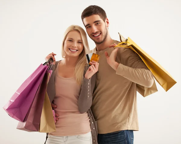 Smiling Couple Holding Shopping Bags Royalty Free Stock Images