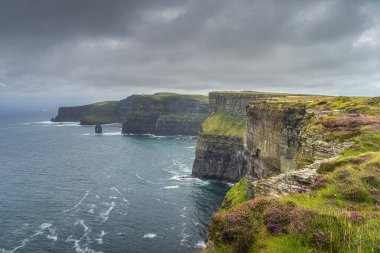 Iconic Cliffs of Moher with OBriens Tower on far distance, Ireland