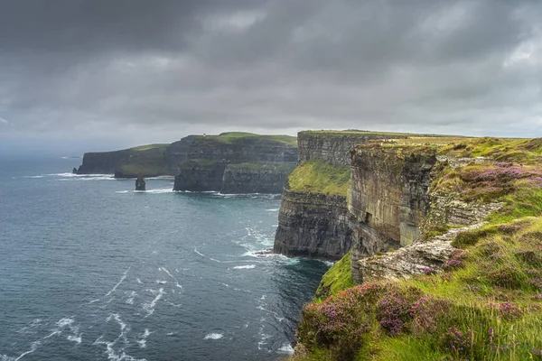 Iconic Cliffs of Moher with OBriens Tower on far distance, Ireland — стокове фото