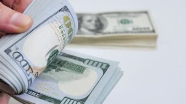 Counting stack of American dollars. Cash