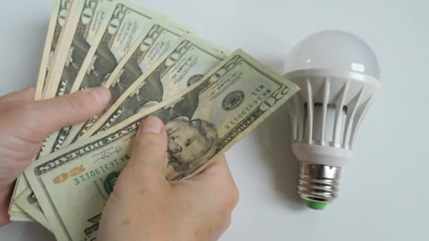 Concepto Precios Altos Electricidad Mano Sostiene Dólares — Vídeos de Stock