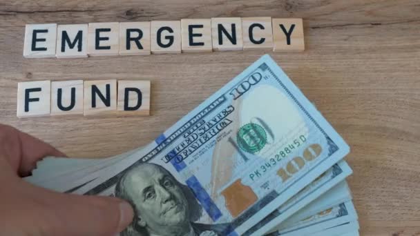 Placing Emergency Fund Money Table American Dollars — Stockvideo