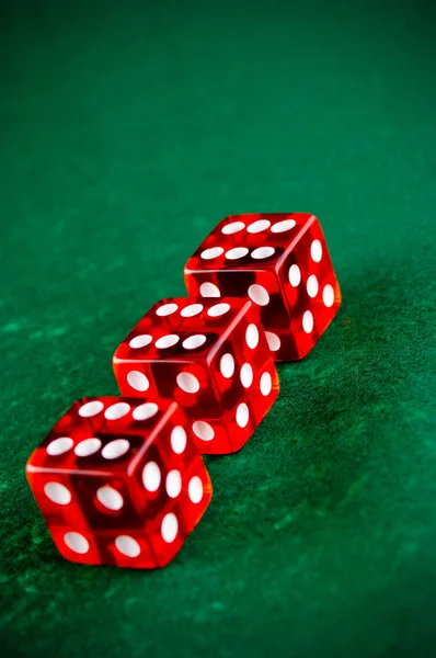 Three red dices in the casino — Stock Photo, Image