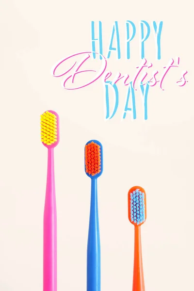 Greeting Card Three Multi Colored Toothbrushes Beige Background Inscription Happy — Stock Photo, Image