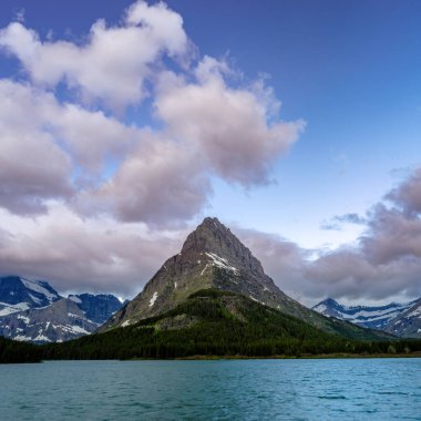 Single mountain peak above a lake in Glacier Montana
