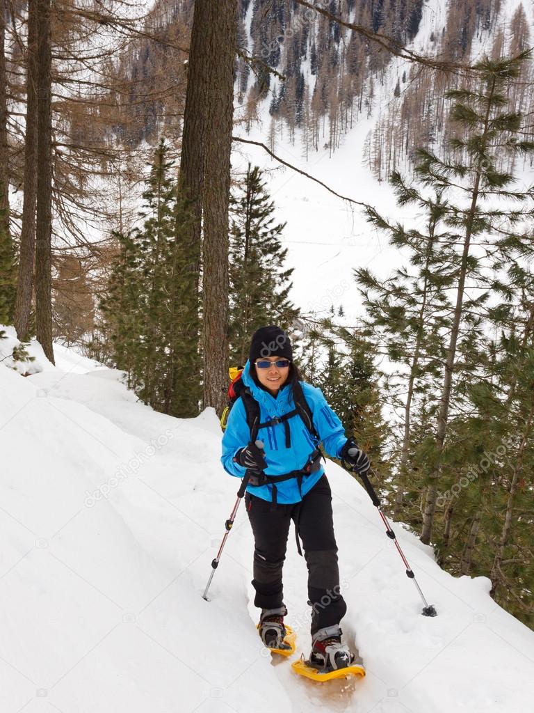 Young Woman Snowshoeing in South Tyrol