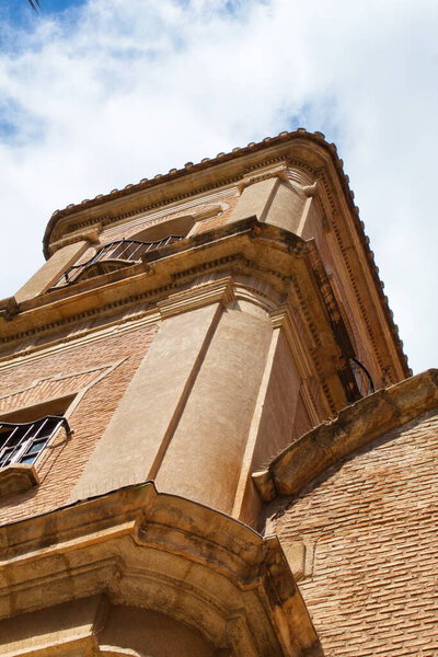 Beautiful high tower with bell tower in the baroque church of Santa Eulalia in Murcia