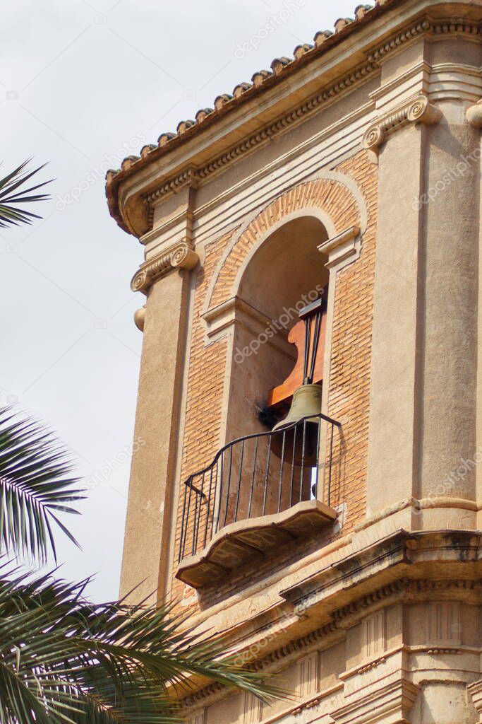 Beautiful high tower with bell tower in the baroque church of Santa Eulalia in Murcia