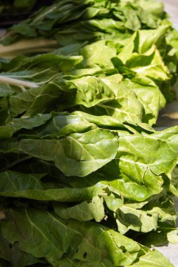 Set of green chard in a stall of a weekly market in Murcia