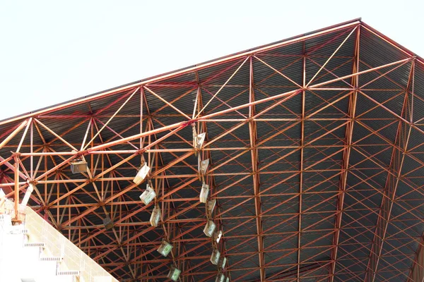 Metal structure for protection against rain and sun in a soccer field