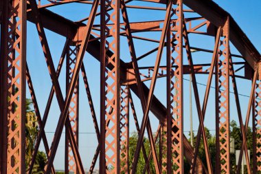 Metal structure of an old bridge with a useful design to support the weight of cars and trucks that cross the river