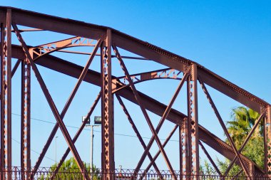 Metal structure of an old bridge with a useful design to support the weight of cars and trucks that cross the river