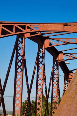 Metal structure of an old bridge with a useful design to support the weight of cars and trucks that cross the river