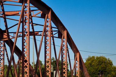 Metal structure of an old bridge with a useful design to support the weight of cars and trucks that cross the river