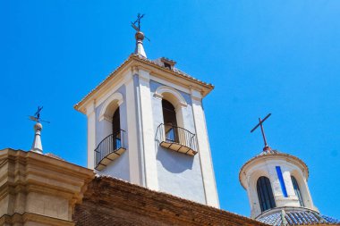 Parish Church of Saint Lawrence in Murcia with facade, bell tower and dome on a sunny day