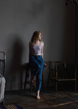 A girl in an atmospheric studio in a light key. High quality photo