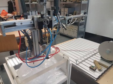 Pneumatic machine in an electromechanical lab. Extruded aluminum profile clipart