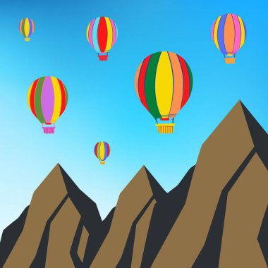 Sıcak hava balonları dağların arka planında