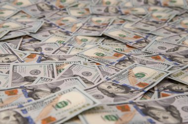 background in the form of untidy dollar bills
