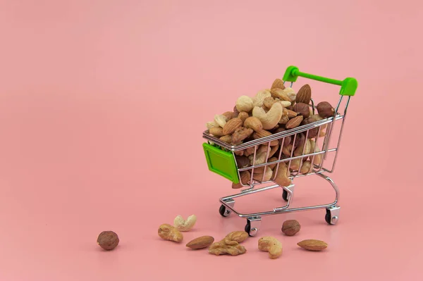 Assorted Nuts Sepermarket Basket Pink Background — 스톡 사진