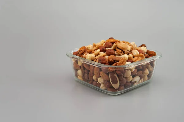 Assorted Nuts Glass Plate Gray Background — Photo