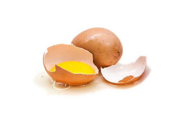 Two eggs and one broken, yolk — Stock Photo, Image