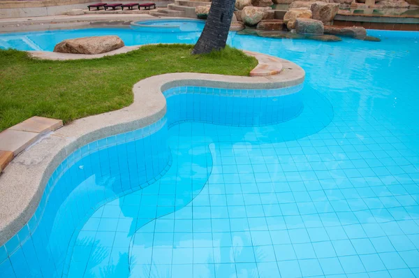 Blue swimming pool in hotel — Stock Photo, Image