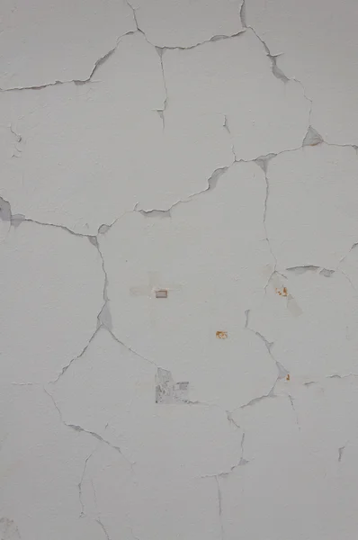 Тріснута фарба на бетонній стіні — стокове фото