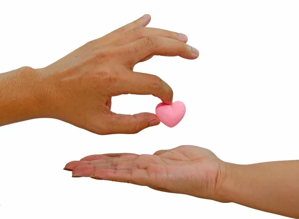 Hand giving pink heart isolated on white background — Stock Photo, Image