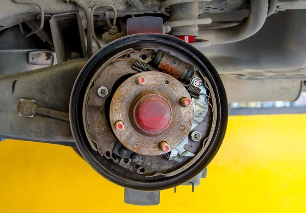 Car under repair on hoist at service station — Stock Photo, Image